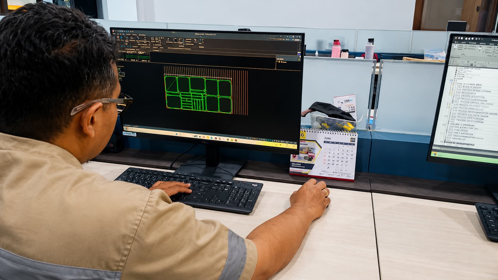Engineer preparing a machining programme at a CAM workstation